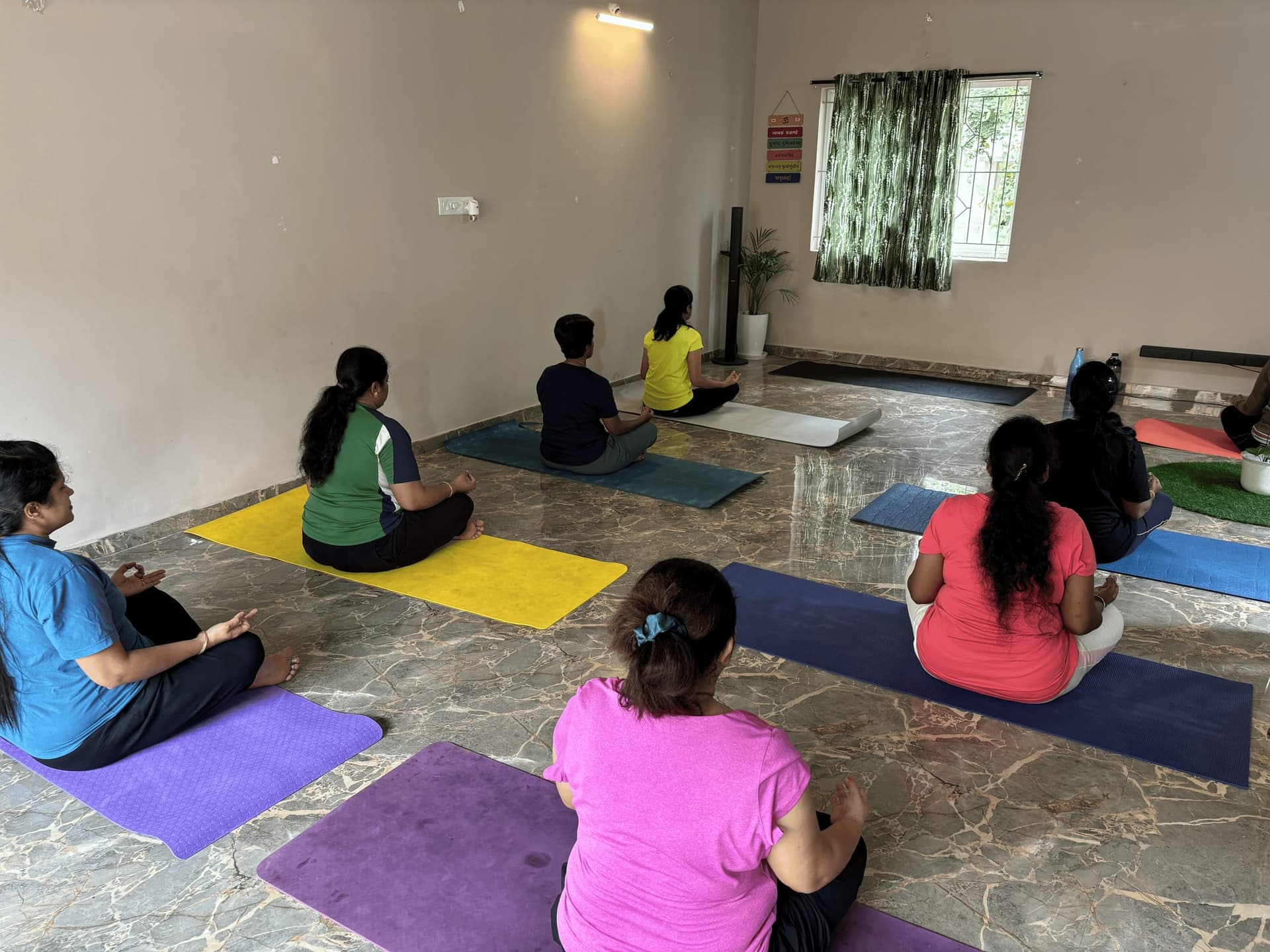Students practising together in the YogaNiroga studio